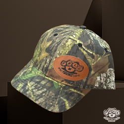 MOSSY OAK SNAP BACK WITH LEATHER PATCH.